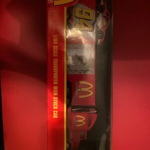 Nascar Red and Yellow Transporter with Stock Car